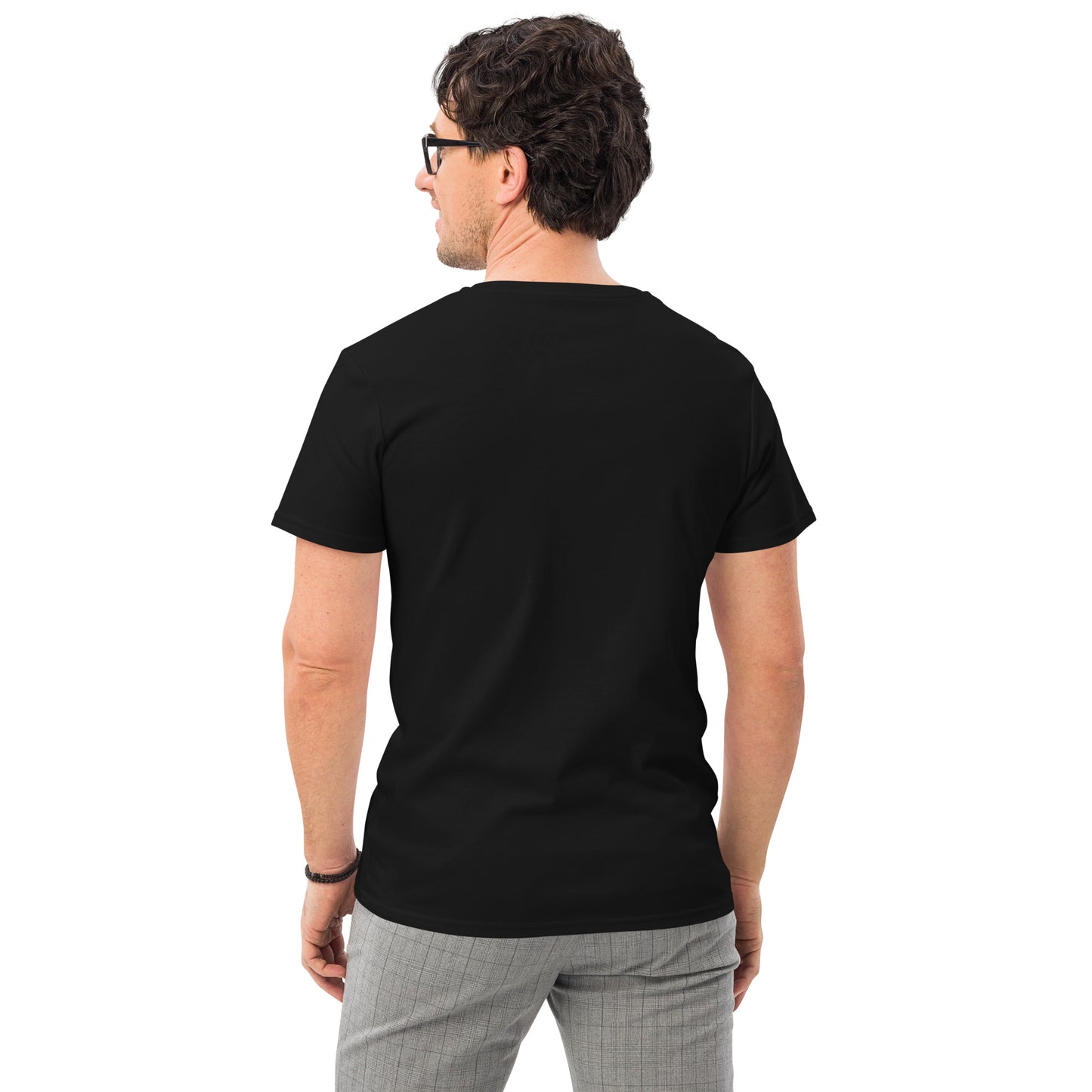 back view of a white man wearing a black t-shirt