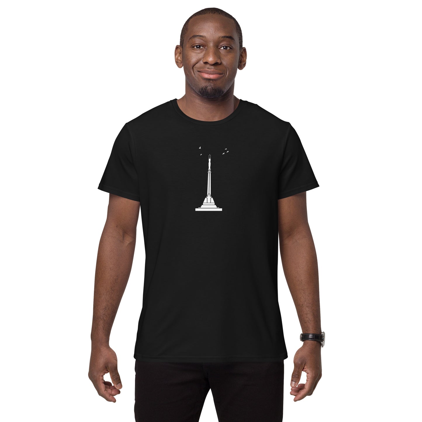 Front view of a Black man wearing a black t-shirt featuring Riga's Liberty Monument
