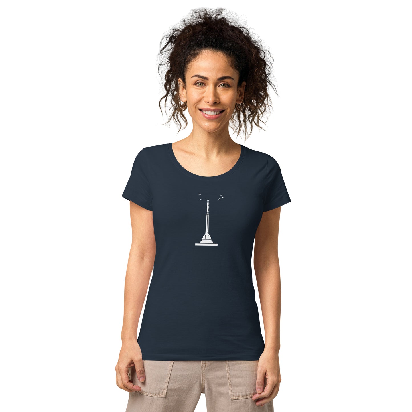 Front view of a brunette woman wearing a French-navy t-shirt with Riga's liberty monument on the shirt