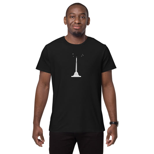 Front view of a Black man wearing a black t-shirt featuring Riga's Liberty Monument