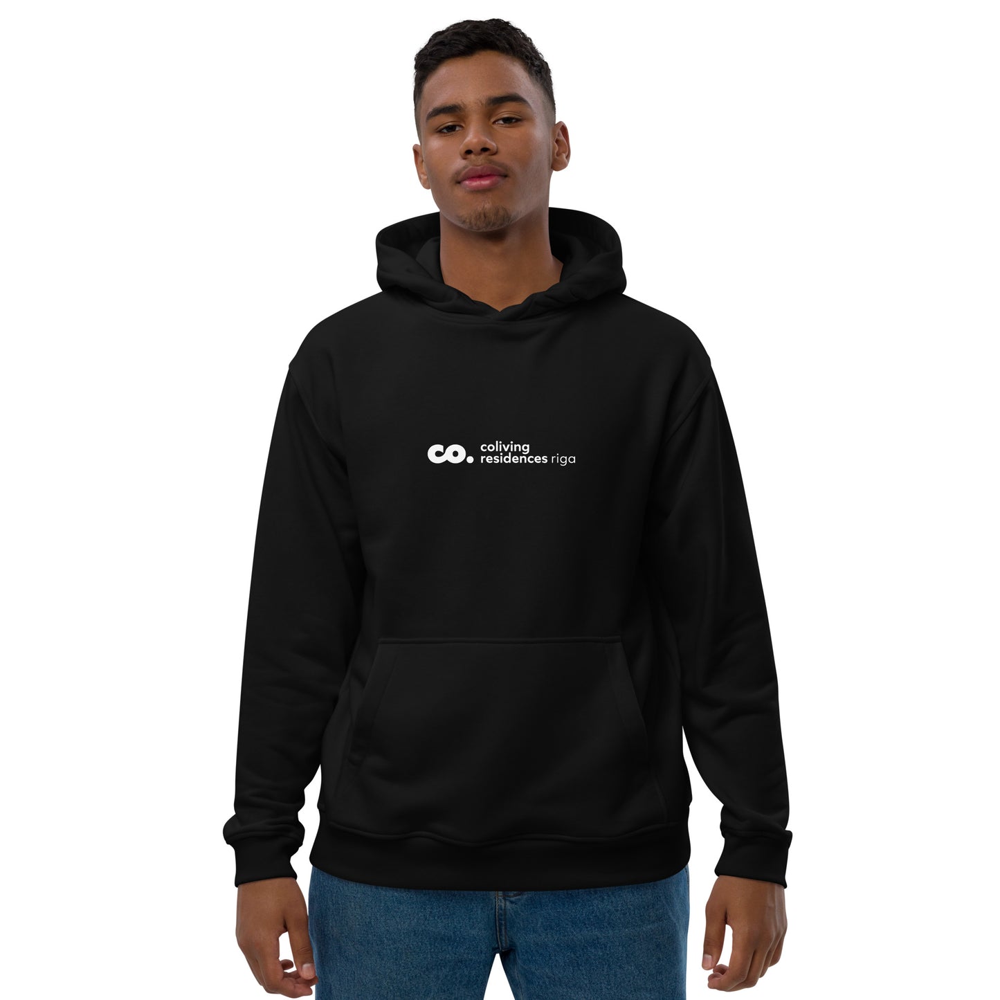 front view of a black man wearing a black hoodie with the Coliving Residences Riga logo
