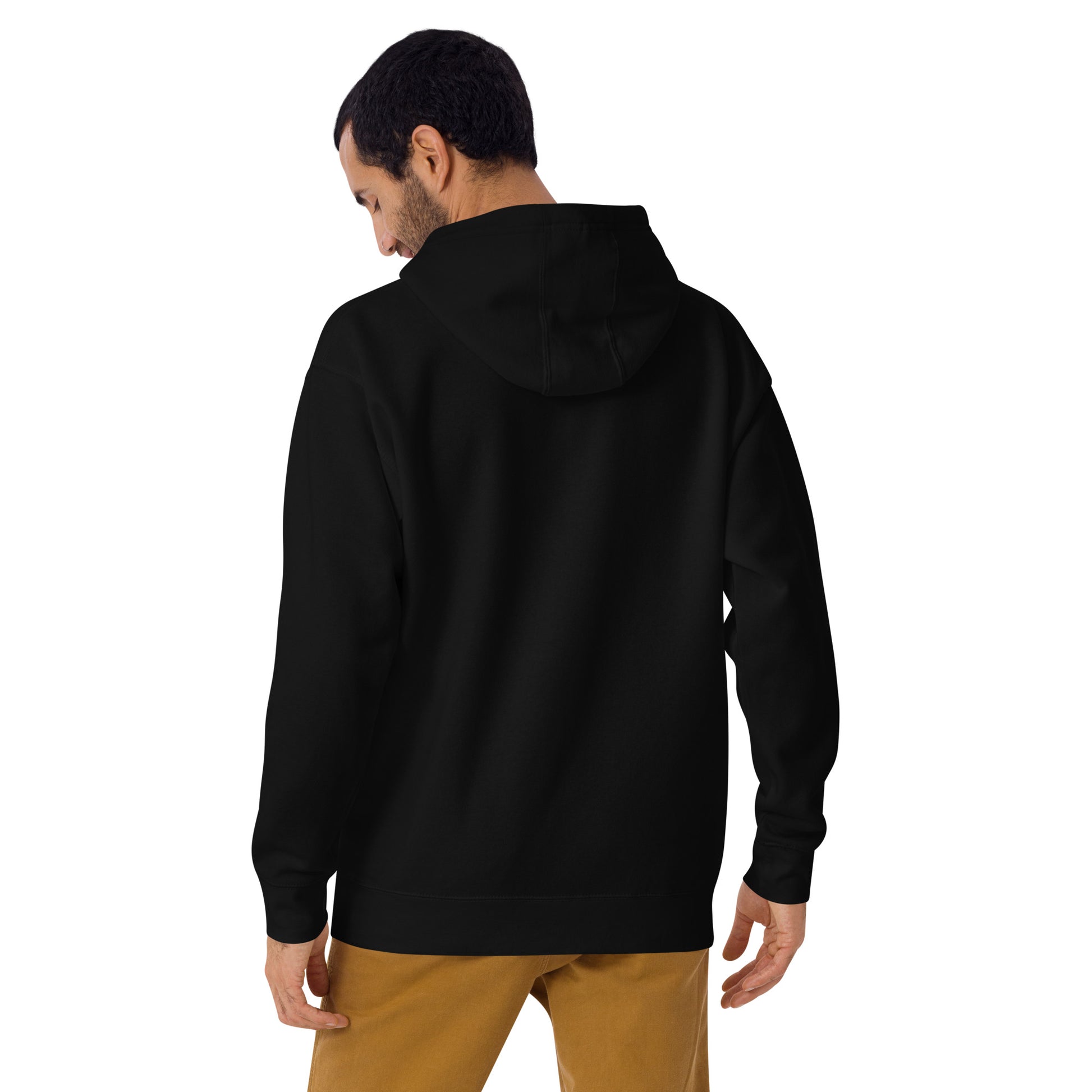 back view of a white man wearing a unisex premium black hoodie