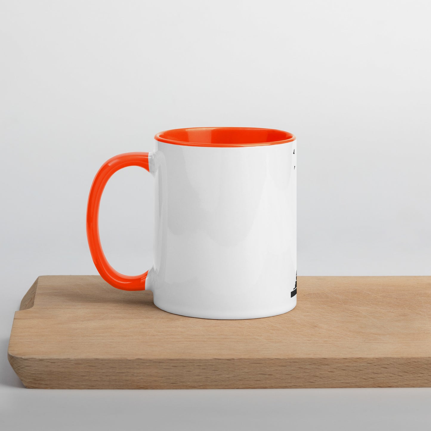 white coffee mug with orange inside