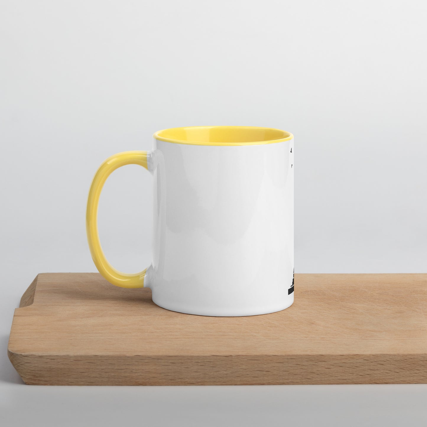white coffee mug with yellow inside