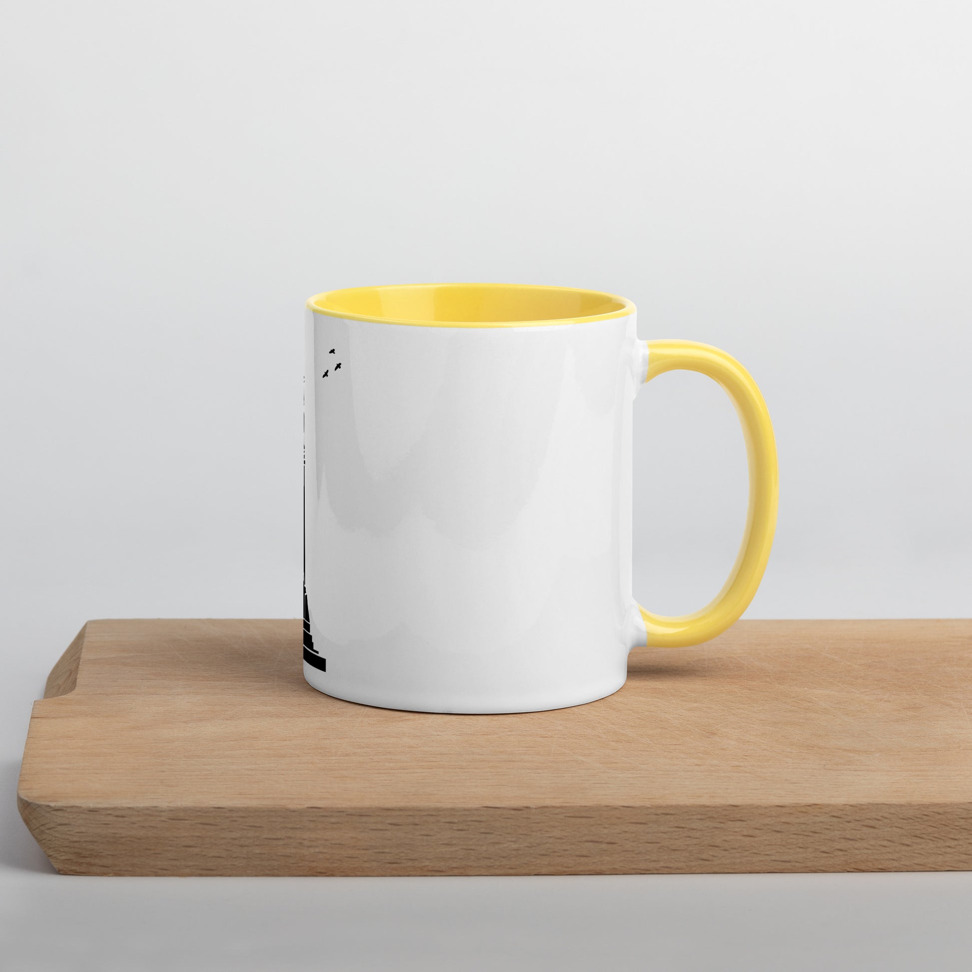 white coffee mug with yellow inside