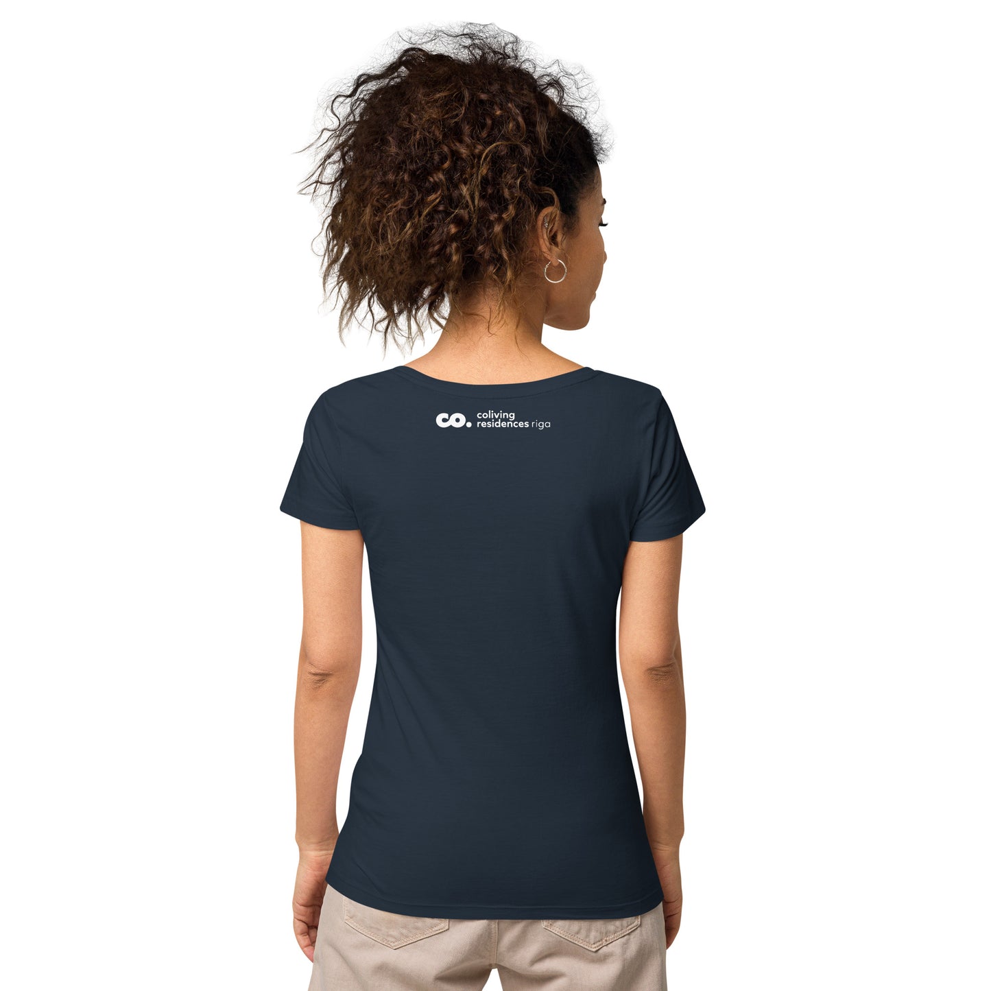 Back view of a brunette woman wearing a French-navy t-shirt with coliving residences riga logo in neck